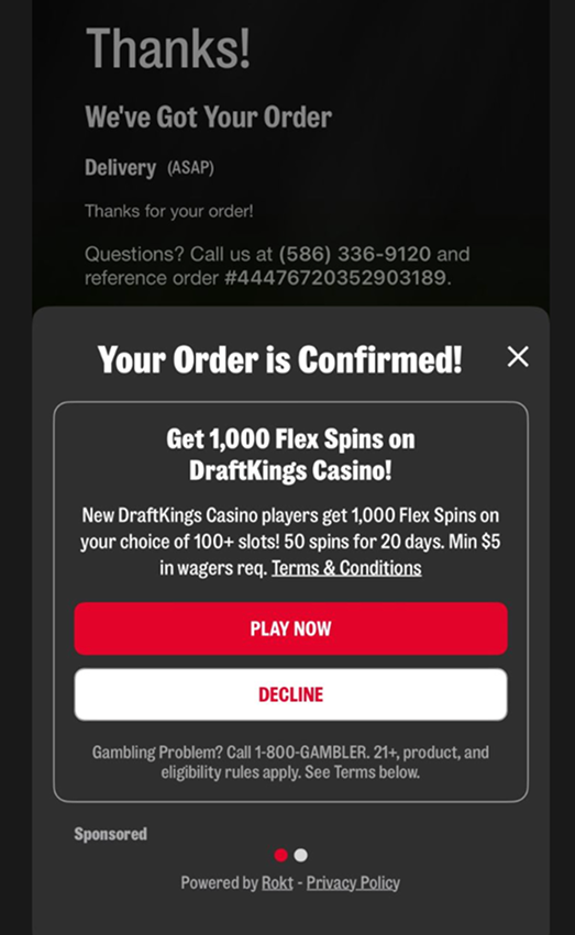 Post-checkout interstitial: a casino ad labeled Sponsored, with a Decline button
